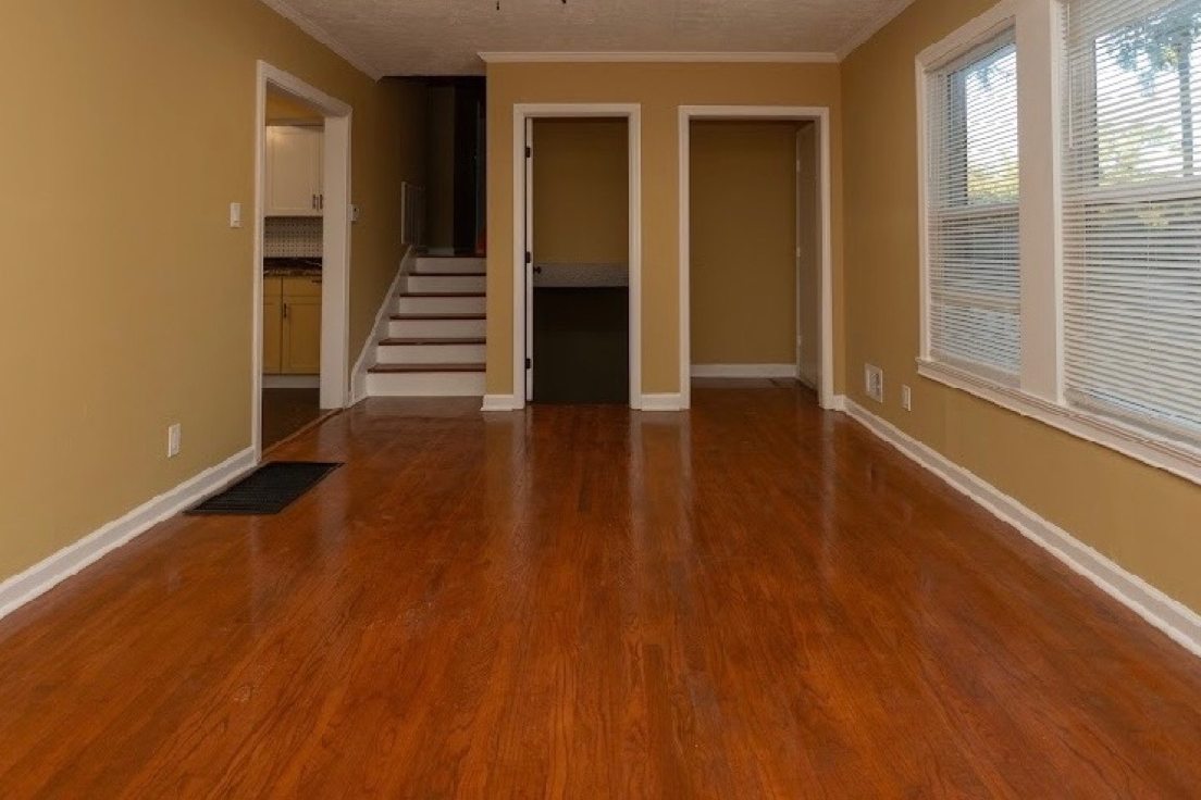 Refinished hardwood floor running through a Columbus living room