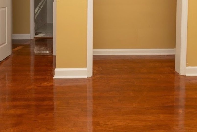 Glossy refinished hardwood in a bedroom with a closet